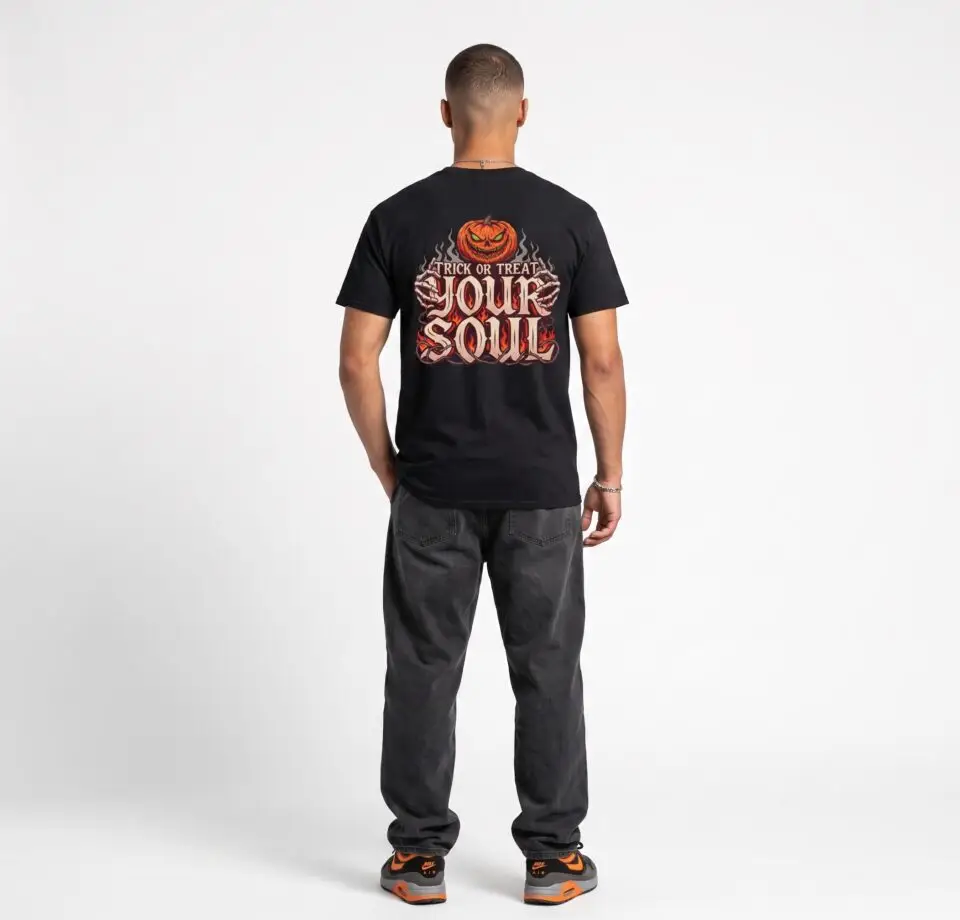 Model wearing the Trick or Treat Your Soul creepy pumpkin Halloween graphic unisex T-shirt in a studio setting Short Product Text A dark Halloween graphic built around “TRICK OR TREAT YOUR SOUL,” with flames, a skeletal hand and a sinister pumpkin. A unisex horror-inspired streetwear tee made for the darker side of Halloween. SEO Keywords / Tags trick or treat your soul t-shirt, Halloween horror tee, creepy pumpkin shirt, horror graphic t-shirt, spooky Halloween shirt, skeleton hand tee, gothic Halloween streetwear, scary pumpkin t-shirt, dark graphic tee, Halloween streetwear, unisex Halloween shirt