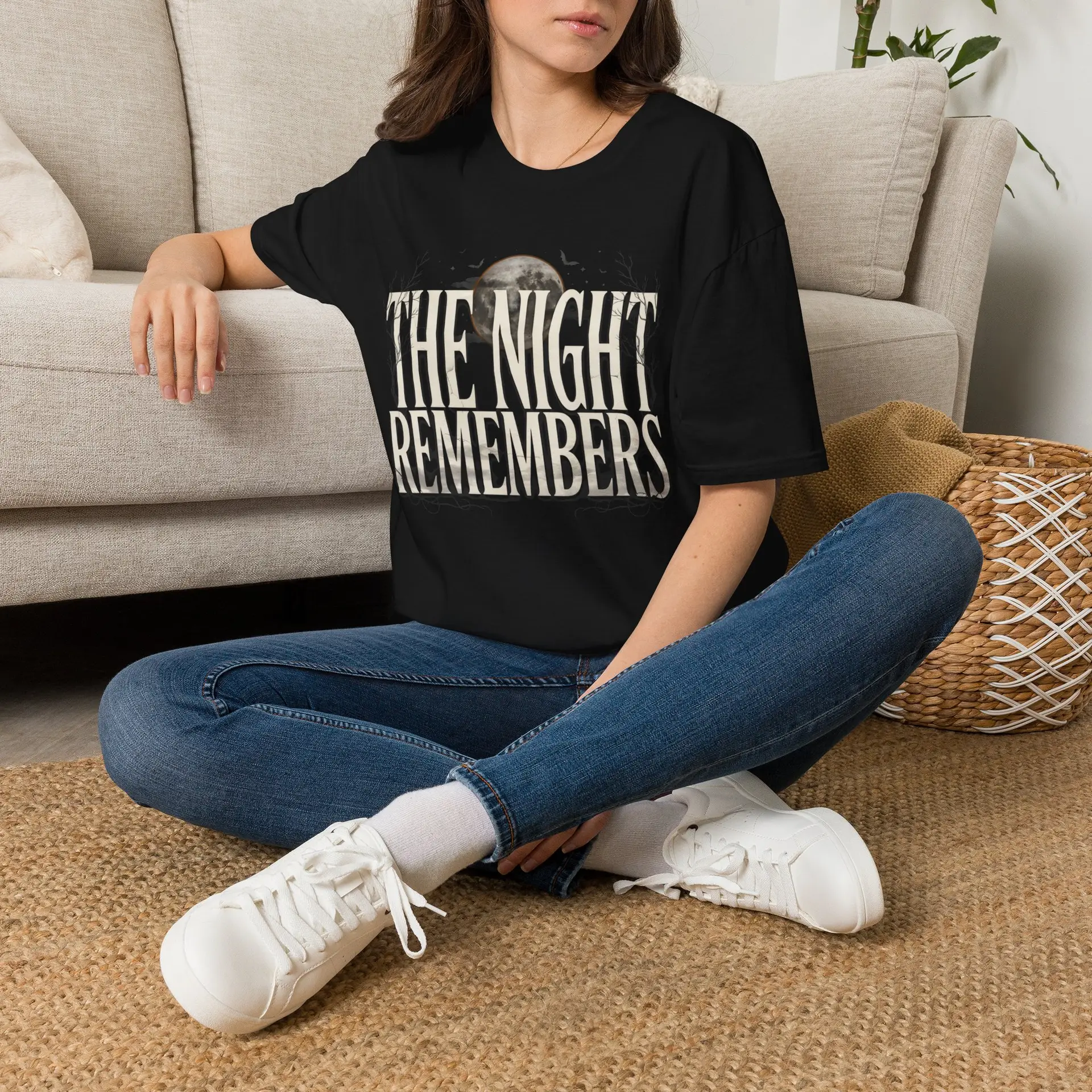 Front Mockup 1 The Night Remembers gothic moon graphic t-shirt featuring vintage typography, full moon, bats and haunted tree artwork. Front Mockup 2 Women's gothic Halloween graphic tee with The Night Remembers vintage moon design. Front Mockup 3 Vintage Halloween t-shirt with bold gothic typography and spooky moon artwork. Front Mockup 4 Dark aesthetic graphic t-shirt featuring The Night Remembers moon and haunted forest illustration. Back Mockup 1 Back view of The Night Remembers gothic Halloween t-shirt showing premium unisex fit. Back Mockup 2 Rear view of premium Gildan 64000 Halloween graphic tee from Brumbynorth. Close-up 1 Close-up of premium DTG printed gothic moon artwork on soft ring-spun cotton fabric. Close-up 2 Detailed close-up of The Night Remembers Halloween graphic showing crisp vintage typography and moon illustration.