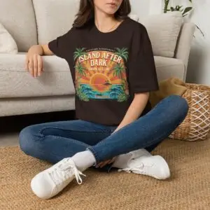 A vintage vacation club graphic with an after-dark attitude. Island After Dark blends tropical palms, sunset colors and ocean waves into an easygoing retro streetwear tee.
