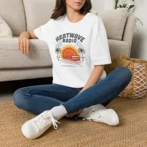 A vintage summer broadcast in T-shirt form. Heatwave Radio combines sunset colors, palm trees and retro radio graphics for an easygoing streetwear look.
