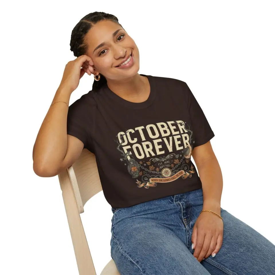 October Forever vintage Halloween graphic t-shirt featuring distressed typography, glowing crescent moon, lantern, autumn leaves, vines, and gothic fall-inspired artwork on a premium Gildan Softstyle unisex tee.