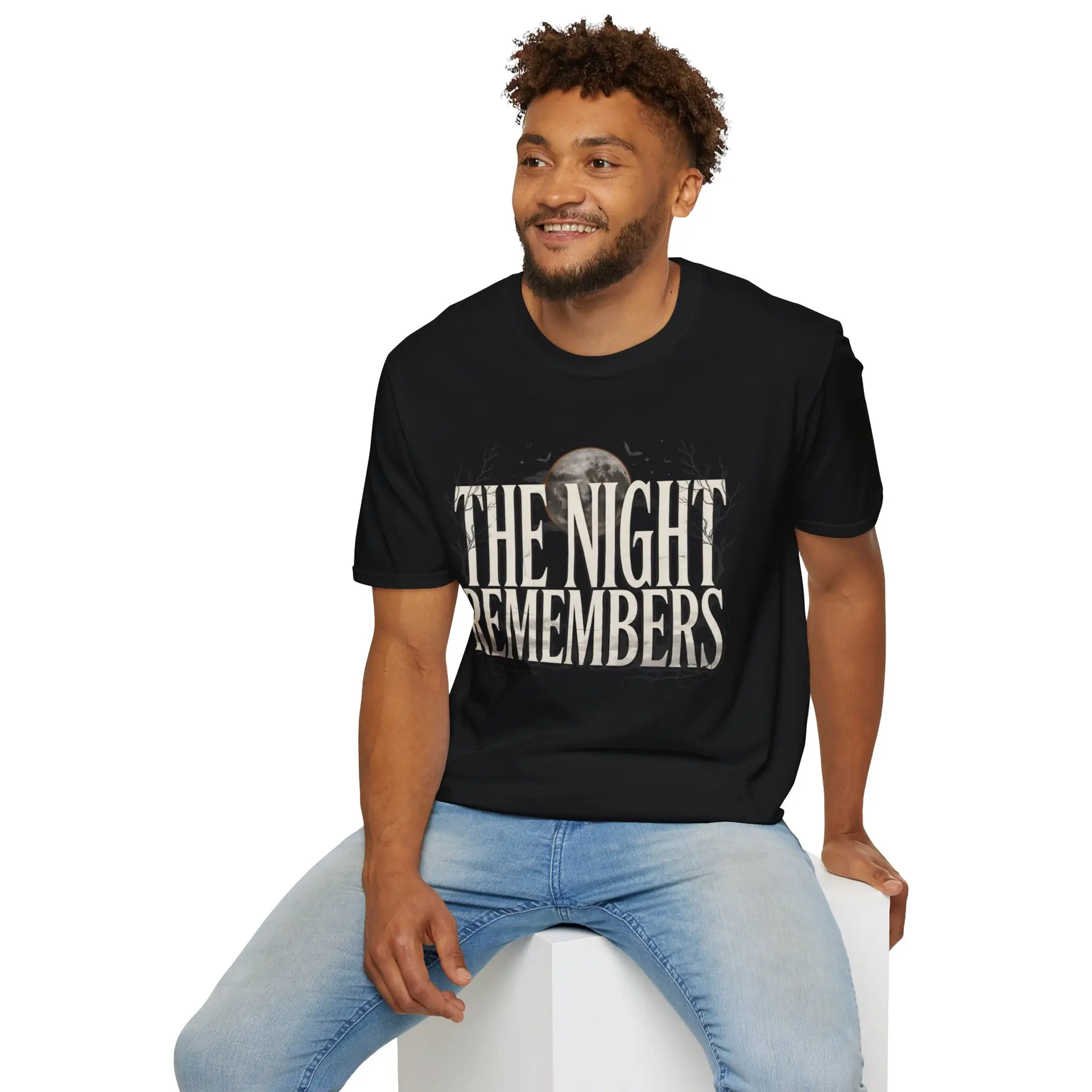 Front Mockup 1 The Night Remembers gothic moon graphic t-shirt featuring vintage typography, full moon, bats and haunted tree artwork. Front Mockup 2 Women's gothic Halloween graphic tee with The Night Remembers vintage moon design. Front Mockup 3 Vintage Halloween t-shirt with bold gothic typography and spooky moon artwork. Front Mockup 4 Dark aesthetic graphic t-shirt featuring The Night Remembers moon and haunted forest illustration. Back Mockup 1 Back view of The Night Remembers gothic Halloween t-shirt showing premium unisex fit. Back Mockup 2 Rear view of premium Gildan 64000 Halloween graphic tee from Brumbynorth. Close-up 1 Close-up of premium DTG printed gothic moon artwork on soft ring-spun cotton fabric. Close-up 2 Detailed close-up of The Night Remembers Halloween graphic showing crisp vintage typography and moon illustration.