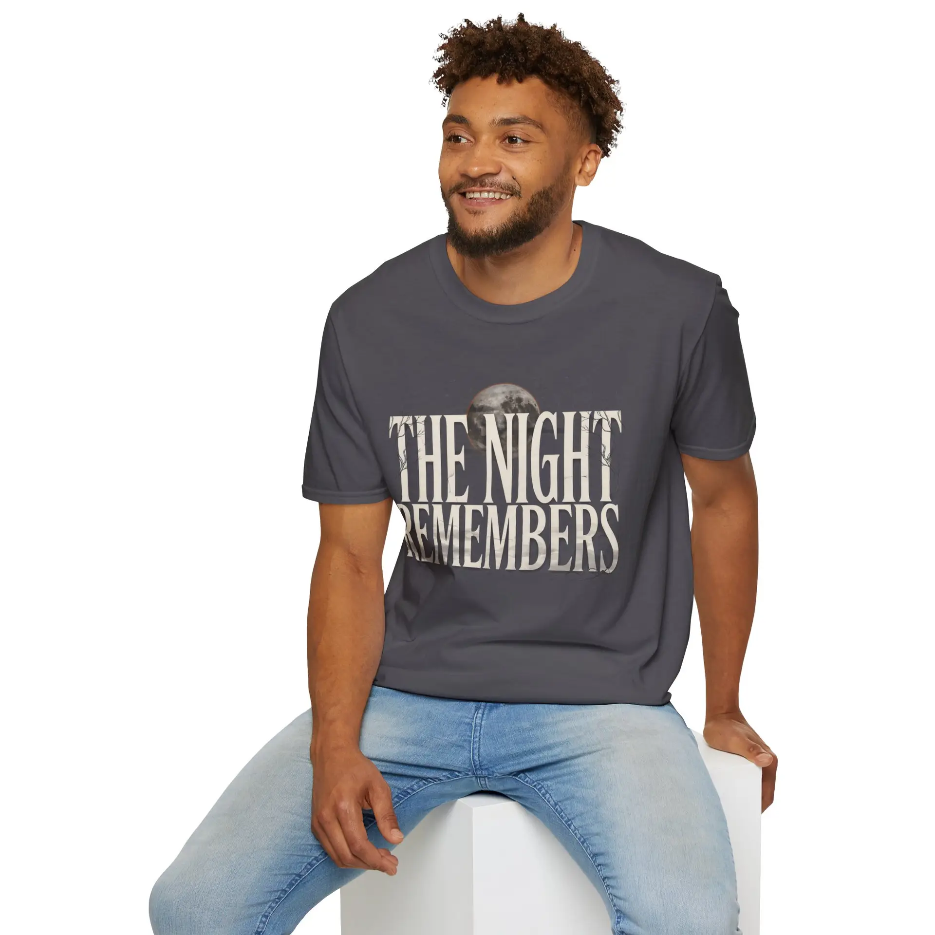 Front Mockup 1 The Night Remembers gothic moon graphic t-shirt featuring vintage typography, full moon, bats and haunted tree artwork. Front Mockup 2 Women's gothic Halloween graphic tee with The Night Remembers vintage moon design. Front Mockup 3 Vintage Halloween t-shirt with bold gothic typography and spooky moon artwork. Front Mockup 4 Dark aesthetic graphic t-shirt featuring The Night Remembers moon and haunted forest illustration. Back Mockup 1 Back view of The Night Remembers gothic Halloween t-shirt showing premium unisex fit. Back Mockup 2 Rear view of premium Gildan 64000 Halloween graphic tee from Brumbynorth. Close-up 1 Close-up of premium DTG printed gothic moon artwork on soft ring-spun cotton fabric. Close-up 2 Detailed close-up of The Night Remembers Halloween graphic showing crisp vintage typography and moon illustration.