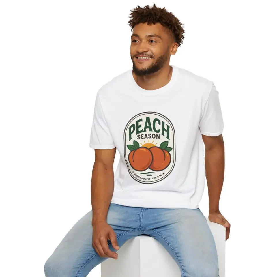 Peach Season vintage graphic T-shirt worn by a female model with relaxed black jeans in a studio setting. Shorter SEO Alt Text Peach Season vintage fruit graphic unisex T-shirt