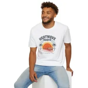 A vintage summer broadcast in T-shirt form. Heatwave Radio combines sunset colors, palm trees and retro radio graphics for an easygoing streetwear look.