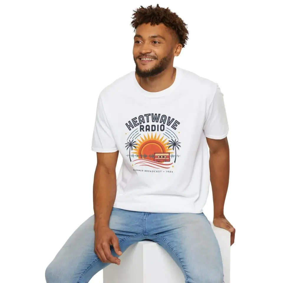 A vintage summer broadcast in T-shirt form. Heatwave Radio combines sunset colors, palm trees and retro radio graphics for an easygoing streetwear look.