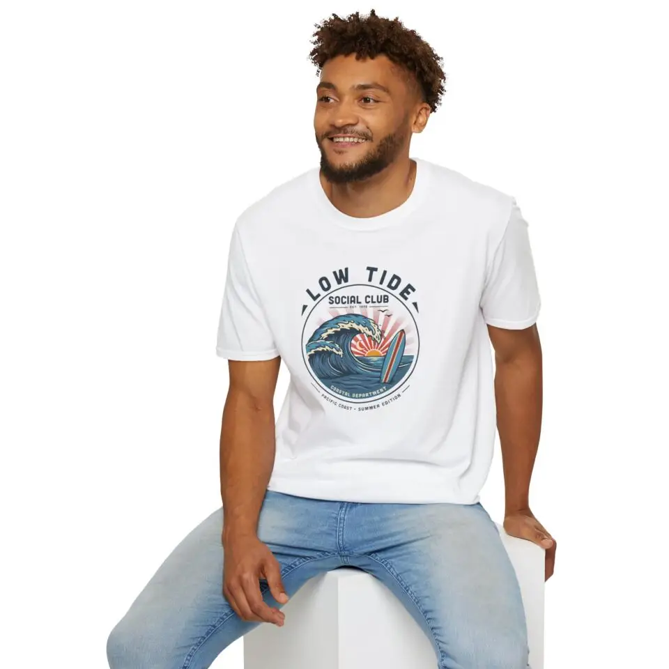 A laid-back surf tee built around a vintage coastal crest, curling wave, pastel sunset, and retro Low Tide Social Club lettering. Easy everyday streetwear with a relaxed summer feel.