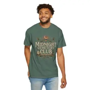 Front View Woman wearing a Comfort Colors Midnight Cemetery Club Halloween graphic t-shirt featuring vintage gothic typography, moonlit cemetery artwork, and a relaxed garment-dyed fit. Lifestyle Alt Text Premium Comfort Colors 1717 garment-dyed Halloween t-shirt with Midnight Cemetery Club vintage cemetery design, photographed on a female model in a casual lifestyle setting.
