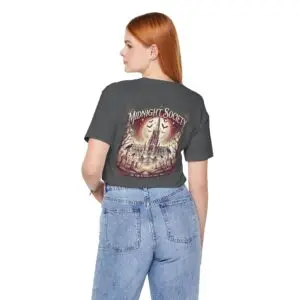 Midnight Society Gothic Halloween graphic t-shirt featuring vintage moon and bat front design. Bella+Canvas Midnight Society Halloween t-shirt with gothic front print on premium unisex cotton tee. Front view of Midnight Society spooky season graphic tee with moon, bats and vintage gothic typography. Premium Halloween graphic t-shirt with minimalist Midnight Society front artwork for autumn fashion. Back Images (2) Back view of Midnight Society Halloween t-shirt featuring large moonlit cemetery, gothic church and vintage horror artwork. Oversized gothic Halloween back graphic with cathedral, moon, ravens and vintage cemetery illustration on Bella+Canvas tee. Close-Up Images (2) Close-up of premium DTF printed Midnight Society graphic showing detailed gothic artwork and sharp vintage typography. Detailed close-up of moonlit cemetery Halloween print with distressed gothic illustration on soft Bella+Canvas cotton t-shirt
