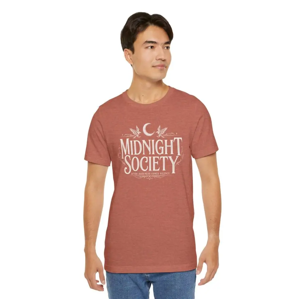 Midnight Society Gothic Halloween graphic t-shirt featuring vintage moon and bat front design. Bella+Canvas Midnight Society Halloween t-shirt with gothic front print on premium unisex cotton tee. Front view of Midnight Society spooky season graphic tee with moon, bats and vintage gothic typography. Premium Halloween graphic t-shirt with minimalist Midnight Society front artwork for autumn fashion. Back Images (2) Back view of Midnight Society Halloween t-shirt featuring large moonlit cemetery, gothic church and vintage horror artwork. Oversized gothic Halloween back graphic with cathedral, moon, ravens and vintage cemetery illustration on Bella+Canvas tee. Close-Up Images (2) Close-up of premium DTF printed Midnight Society graphic showing detailed gothic artwork and sharp vintage typography. Detailed close-up of moonlit cemetery Halloween print with distressed gothic illustration on soft Bella+Canvas cotton t-shirt