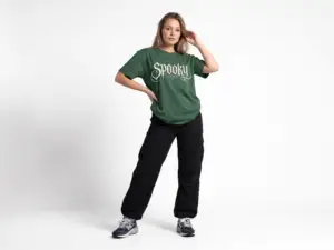 Model wearing a black Spooky Season gothic Halloween graphic unisex T-shirt Short Product Text Lean into Halloween season with a vintage gothic “spooky season” graphic tee. A lightweight unisex T-shirt made for autumn streetwear, horror nights and everyday casual looks.